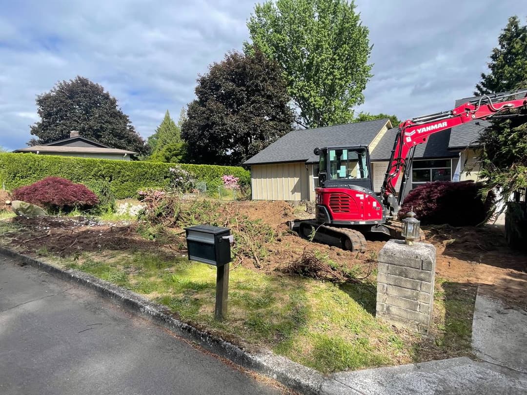 picture of a yard being excavated by an excavator